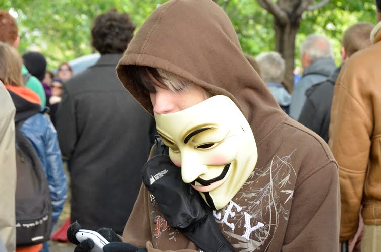 Occupy Montreal Guy Fawkes Mask Texting _DSC9179.JPG